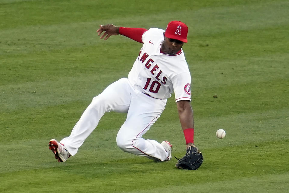 Los Angeles Angels left fielder Justin Upton misses on a line drive from Houston Astros' Alex Bregman, who got an RBI single on the play, during the first inning of a baseball game Monday, April 5, 2021, in Anaheim, Calif. (AP Photo/Marcio Jose Sanchez)