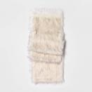 This photo shows the Threshold faux fur table runner. From tablescapes to apparel, the gift possibilities in white are endless for the holidays. (AP Photo/Target).