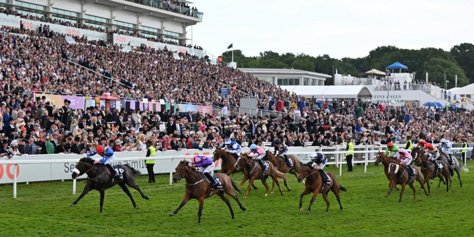 Jockey Barry McHugh rides Tees Spirit (L) to victory in the 'Dash' Handicap on the second day of the Epsom Derby Festival horse racing meeting at Epsom Downs Racecourse in Epsom, south of England, on June 4, 2022. - Britain's Princess Anne, Princess Royal has taken over duties at Epsom from Britain's Queen Elizabeth II. The 96-year-old monarch had been expected to attend the race on Saturday, as part of her Platinum Jubilee celebrations marking 70 years on the throne. (Photo by Glyn KIRK / AFP) (Photo by GLYN KIRK/AFP via Getty Images)