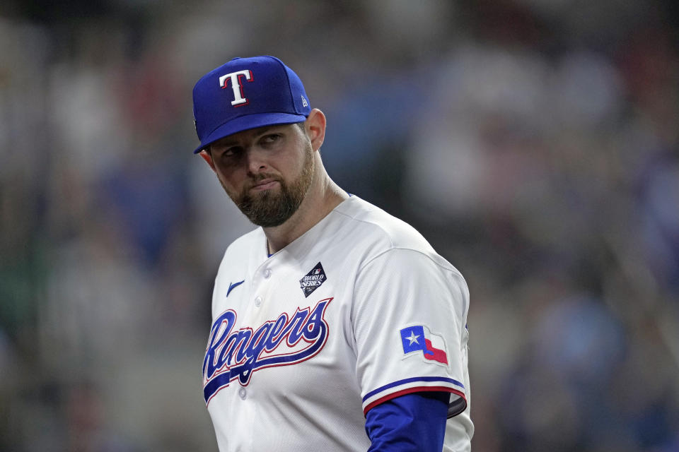 Texas Rangers starting pitcher Jordan Montgomery looks back after being pulled during the seventh inning in Game 2 of the baseball World Series against the Arizona Diamondbacks Saturday, Oct. 28, 2023, in Arlington, Texas. (AP Photo/Godofredo A. Vásquez)