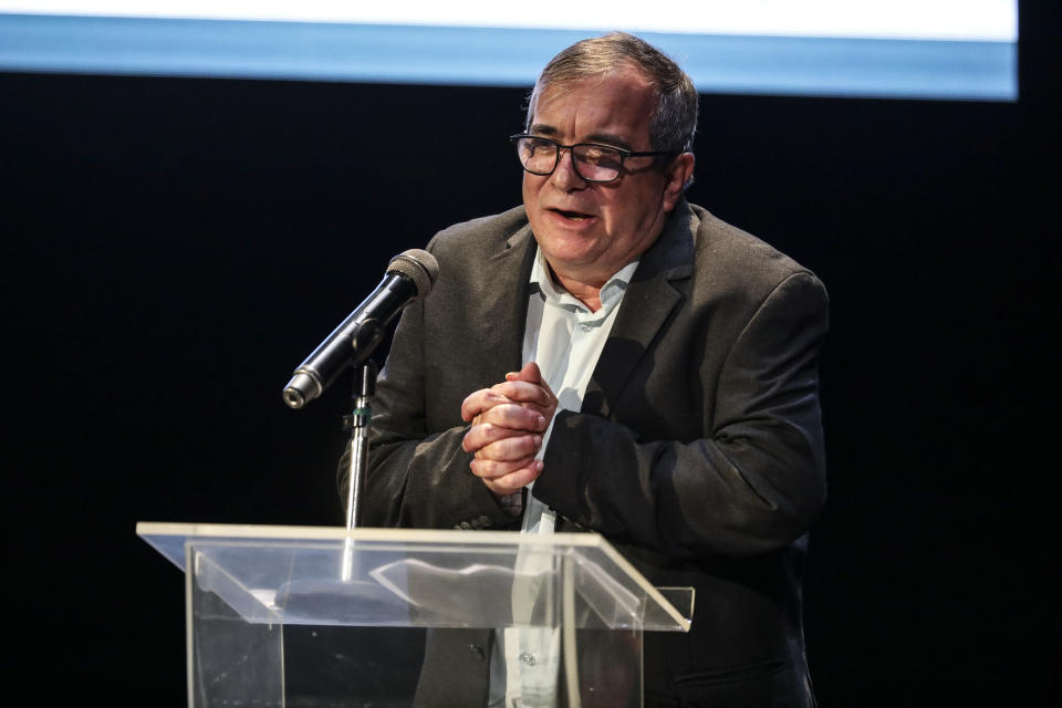 Rodrigo Londoño, also known as Timochenko, the former commander of the Revolutionary Armed Forces of Colombia, FARC, speaks during an event at the Truth Commission to commemorate victims of the country’s decades-long armed conflict, in Bogota, Colombia, Wednesday, June 23, 2021. (AP Photo/Ivan Valencia)