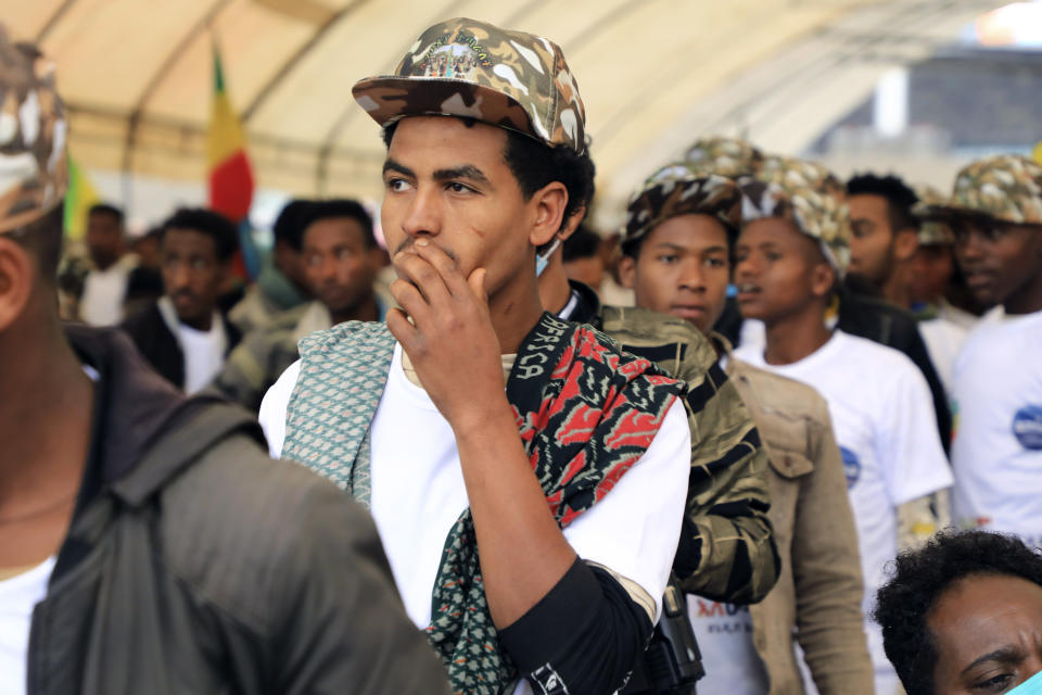 Youth joining the Defense Forces are escorted to Meskel Square, in Addis Ababa, Ethiopia, Tuesday, July 27 2021. A repatriation program is underway for young people from Ethiopia who have decided to join the Defense Forces. (AP Photo)