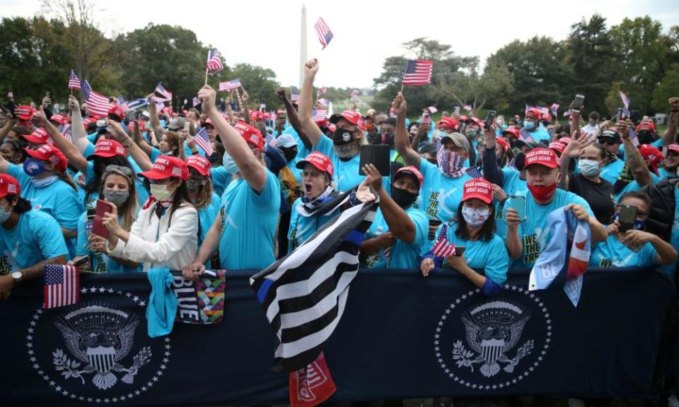 Supporters cheer on Donald Trump during his White House event on 10 October.