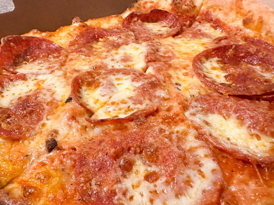 Catch-a-Fire Pizza's Cornerstone, which features pepperoni, four types of cheese and a fire-roasted red sauce.