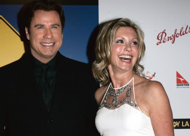 PHOTO: John Travolta, left, and Olivia Newton-John arrive at the The Penfolds Icon Gala Dinner in Los Angeles on Jan. 14, 2006. (Branimir Kvartuc/AP, FILE)