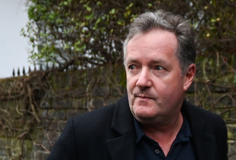 Piers Morgan walks with his daughter Elise in London