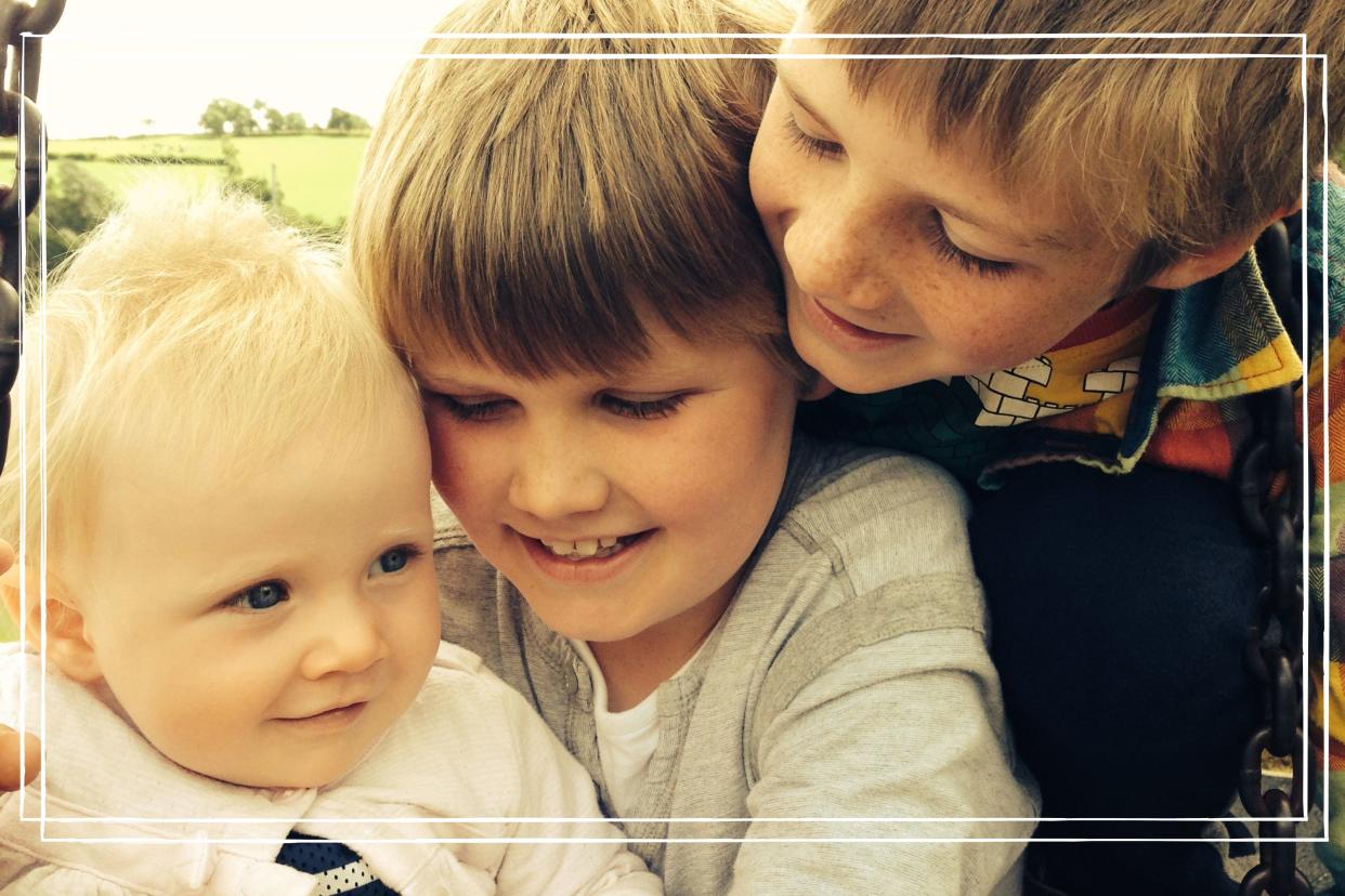  Our writer, Heidi Scrimgeour's three children pictured laughing together in a park. 