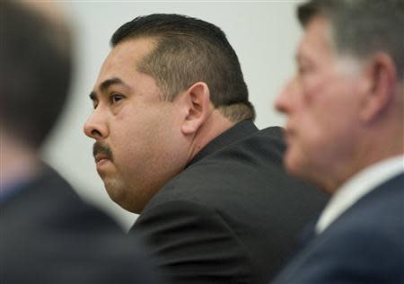 Former Fullerton police officer Manuel Ramos listens as the not guilty verdict is read in the Kelly Thomas murder trial in Santa Ana, California January 13, 2014. REUTERS/Mindy Schauer/Pool