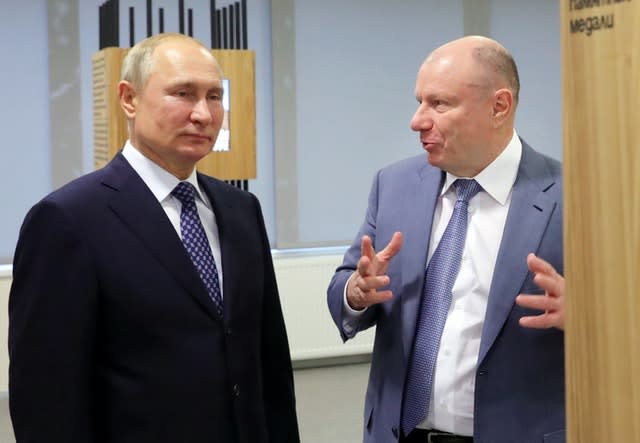 File picture of Vladimir Putin with Vladimir Potanin (Mikhail Klimentyev/Kremlin Pool/AP)