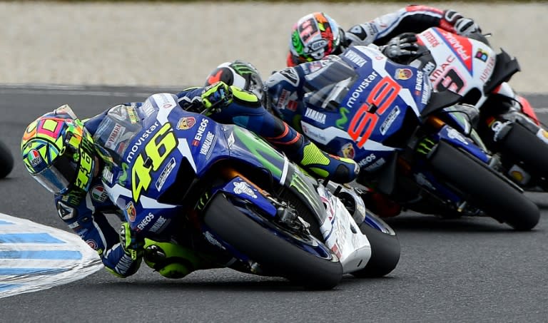 Movistar Yamaha MotoGP's Valentino Rossi (L) powers ahead of teammate Jorge Lorenzo (C) and OCTO Pramac Yakhnich's rider Danilo Petrucci during the Australian MotoGP