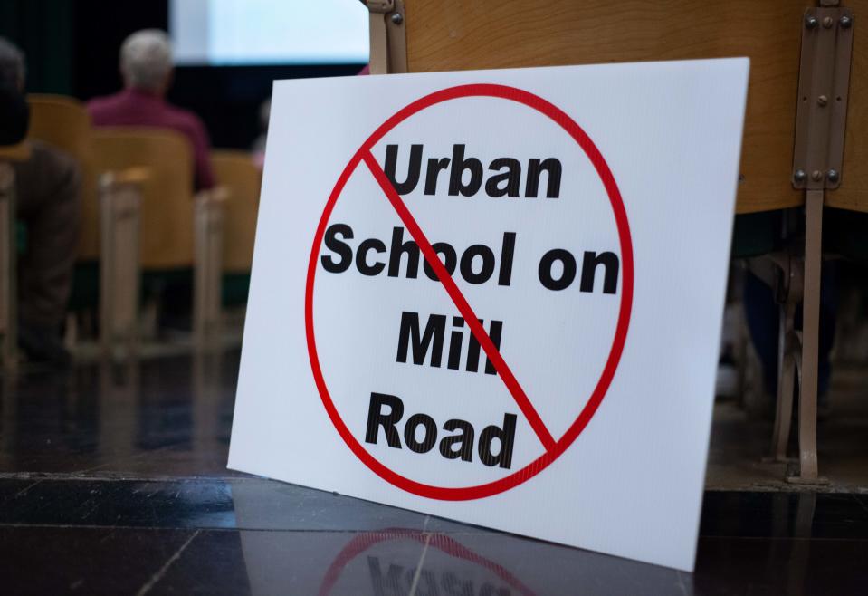 A sign indicating the owner does not want Urban Middle School to be moved to Mill Road sits at the entrance to the auditorium during Sheboygan Area School District traffic study meeting. This sign is also currently being featured on multiple houses in the Mill Road area.