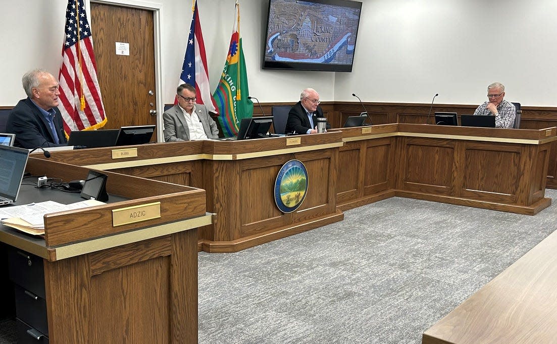 From left, Licking County Commissioners Tim Bubb, Duane Flowers and Rick Black during a meeting on Thursday. The commissioners unanimously voted to prohibit utility-scale solar farms, which are defined as producing 50 megawatts or more, from Etna Township.