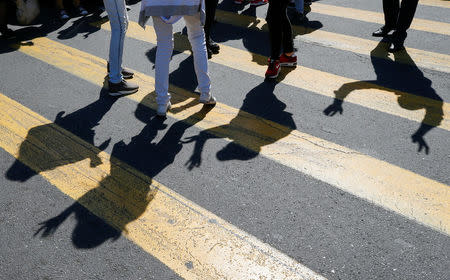 Armenian opposition supporters dance on a pedestrian crossing as they block a road after protest movement leader Nikol Pashinyan announced a nationwide campaign of civil disobedience in Yerevan, Armenia May 2, 2018. REUTERS/Gleb Garanich