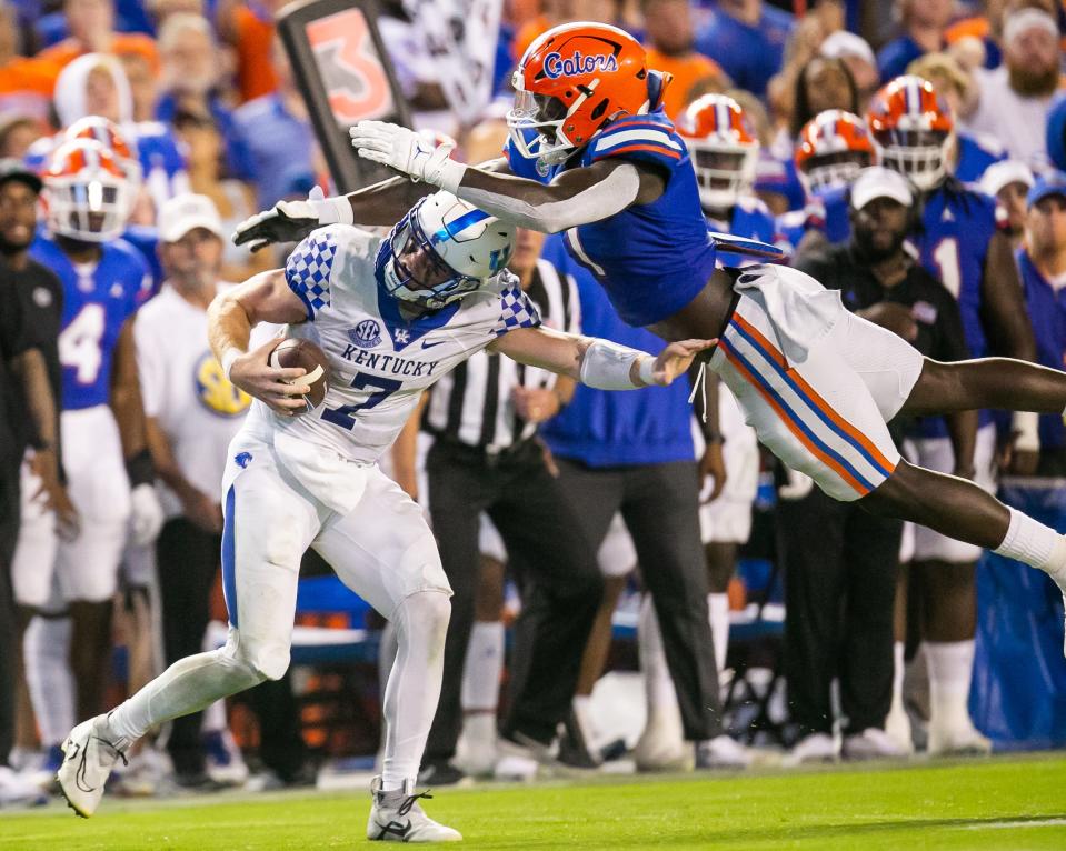 Florida Gators linebacker Brenton Cox Jr. (1) dives to tackle Kentucky Wildcats quarterback Will Levis (7) in the second half at Steve Spurrier Field at Ben Hill Griffin Stadium in Gainesville, FL on Saturday, September 10, 2022. The Kentucky Wildcats defeated the Florida Gators 26-16. [Doug Engle/Gainesville Sun]