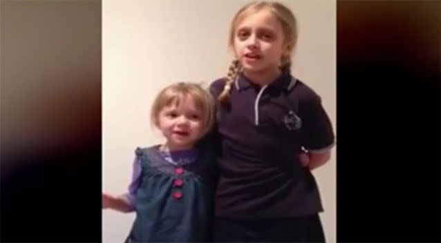 Big sister Caitlin and little Willow pictured mid-performance. Photo: 7 News