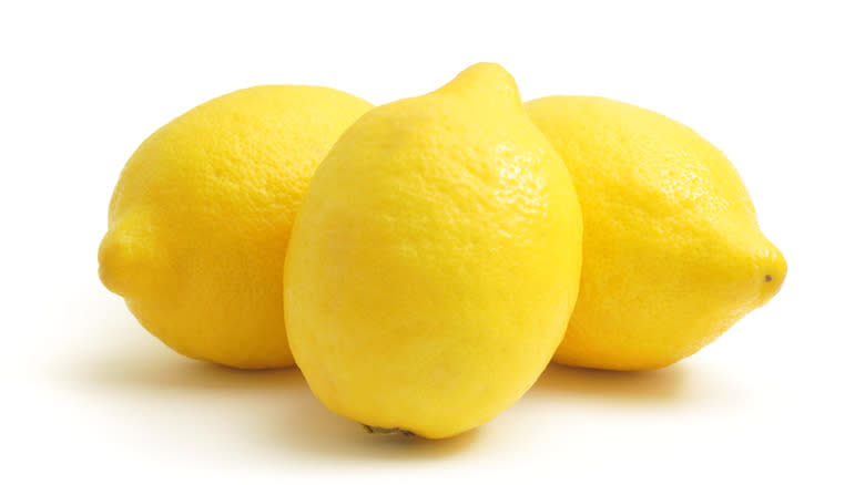Three lemons on white background