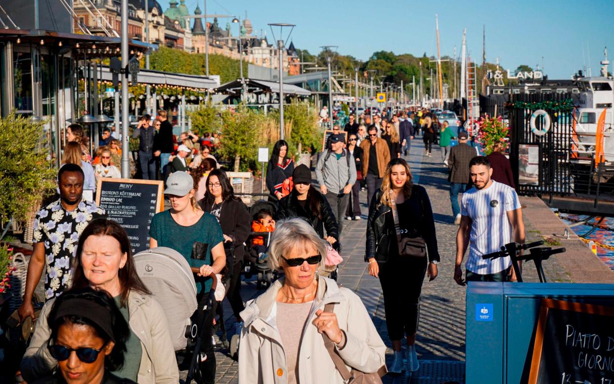 Pedestrians on Stranvagen in Stockholm on September 19 - JONATHAN NACKSTRAND/AFP via Getty Images