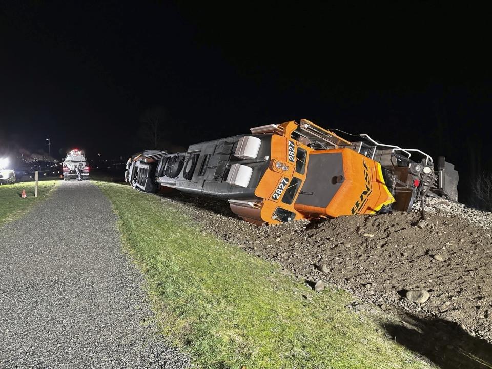 This photo provided by the Washington Department of Ecology shows a derailed BNSF train on the Swinomish tribal reservation near Anacortes, Wash. on March 16, 2023. A federal judge on Monday, June 17, 2024 ordered BNSF Railway to pay nearly $400 million to a Native American tribe in Washington state after finding that the company intentionally trespassed when it repeatedly ran 100-car trains carrying crude oil across its reservation. (Washington Department of Ecology via AP)