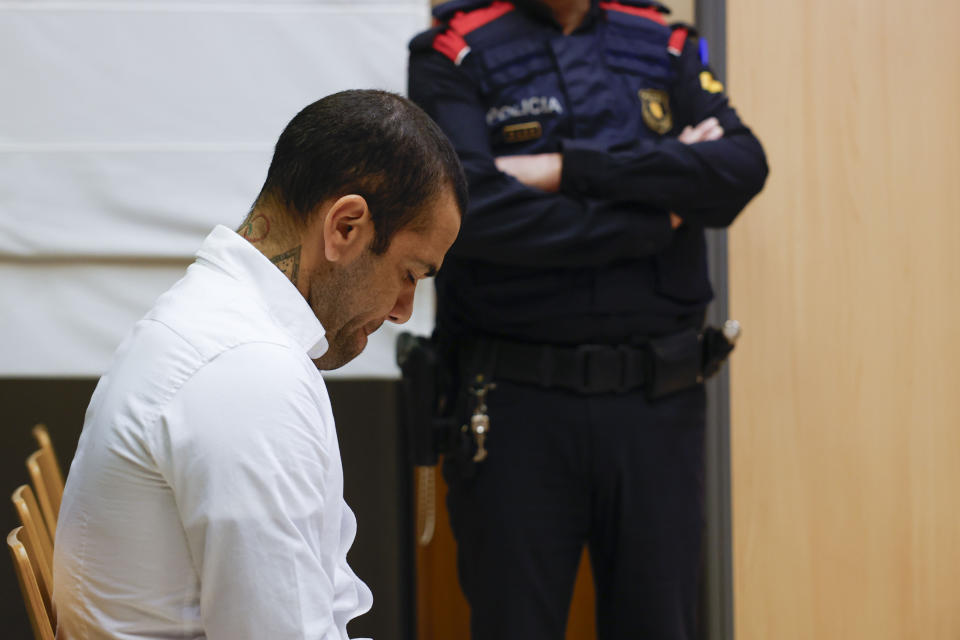 Brazilian soccer star Dani Alves sits during his trial in Barcelona, Spain, Monday, Feb. 5, 2024. Dani Alves goes on trial Monday a year after he allegedly sexually assaulted a young woman at a Barcelona nightclub. The 40-year-old Alves is accused of sexually assaulting the woman on the night of Dec. 30, 2022. He denies any wrongdoing. (Alberto Estevez/Pool Photo via AP)