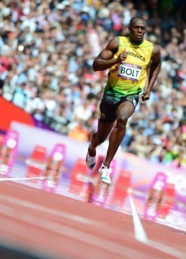 Jamaica's Usain Bolt competes in the men's 100m heats at the London Olympics on Saturday