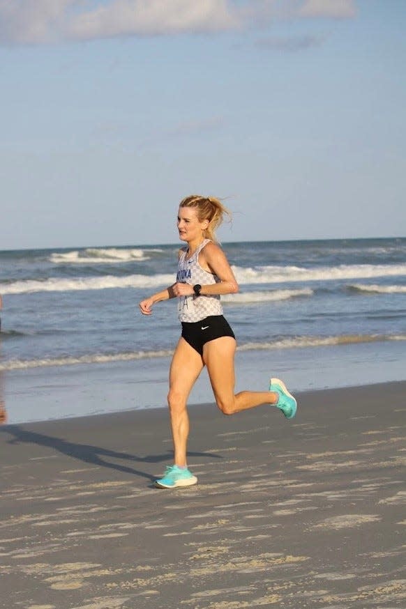 Shannon Jones runs along the beach while competing for Daytona State College.