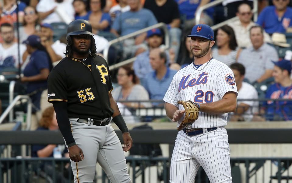 NEW YORK, NEW YORK - JULY 26:   Josh Bell #55 of the Pittsburgh Pirates in action against Pete Alonso #20 of the New York Mets at Citi Field on July 26, 2019 in New York City. The Mets defeated the Pirates 6-3. (Photo by Jim McIsaac/Getty Images)