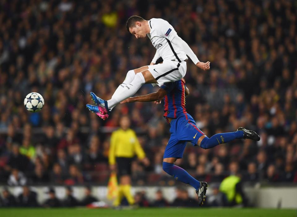 <p>Julian Draxler of PSG jumps with Rafinha of Barcelona during the UEFA Champions League Round of 16 second leg match between FC Barcelona and Paris Saint-Germain at Camp Nou on March 8, 2017 in Barcelona, Spain. (Photo by Laurence Griffiths/Getty Images) </p>