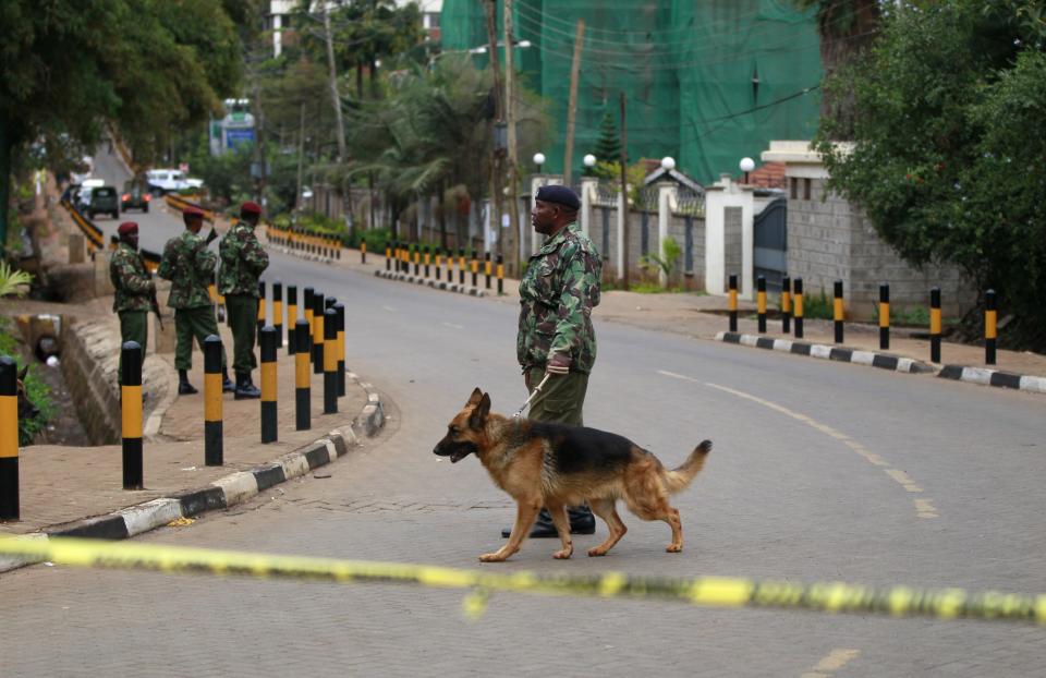 A policeman patrols with his dog near the Westgate Shopping Centre in Kenya's capital Nairobi