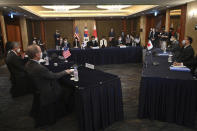 U.S. special representative for North Korea Sung Kim, left, talks with South Korea's Special Representative for Korean Peninsula Peace and Security Affairs Noh Kyu-duk, center, and Japanese Foreign Ministry's Director-General of the Asian and Oceanian Affairs Bureau Takehiro Funakoshi, right, during their trilateral meeting at a hotel in Seoul Monday, June 21, 2021. (Jung Yeon-je/Pool Photo via AP)