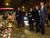 <p>“After arriving in France to attend the Climate Change Summit, the President, with French President François Hollande and Paris Mayor Anne Hidalgo, made an unannounced stop just after midnight at the memorial in front of le Batacian, the site of a Paris terrorist attack on november 30, 2015.” (Pete Souza/The White House) </p>