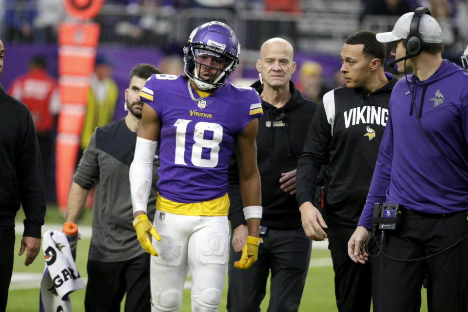 Minnesota Vikings wide receiver Justin Jefferson (18) is helped off the field after getting injured during the first half of an NFL football game against the Indianapolis Colts, Saturday, Dec. 17, 2022, in Minneapolis. (AP Photo/Andy Clayton-King)