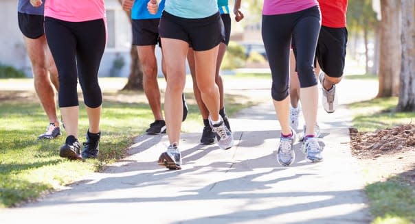 Close Up Of Runners Feet On Suburban Street