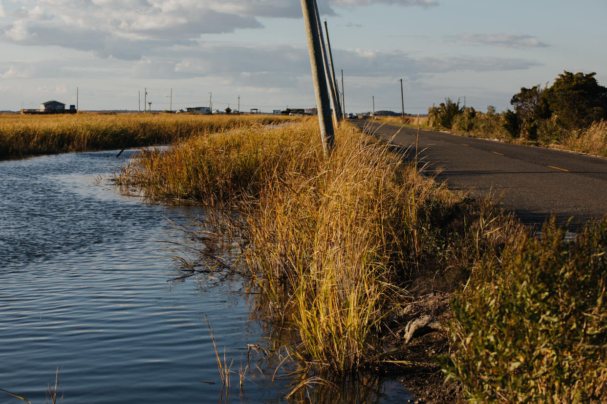 A view of the road to Money Island Marina with water from the Delaware Bay coming dangerously close to the road is seen in Downe, New Jersey on Tuesday, October 18, 2022. (Michelle Gustafson for The Washington Post via Getty Images)