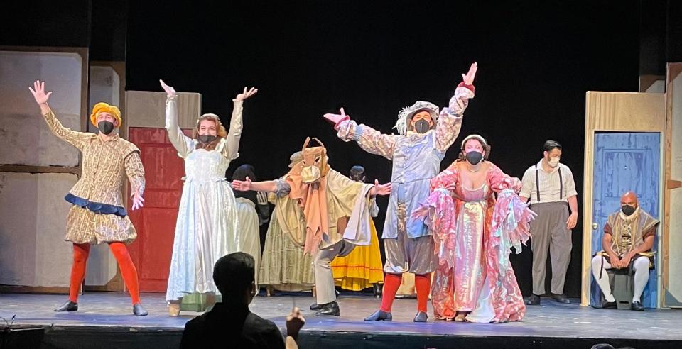 The leading cast, plus donkey, in rehearsal for College Light Opera Company's production of "Kiss Me, Kate." (The actors do not wear masks for the performances.)