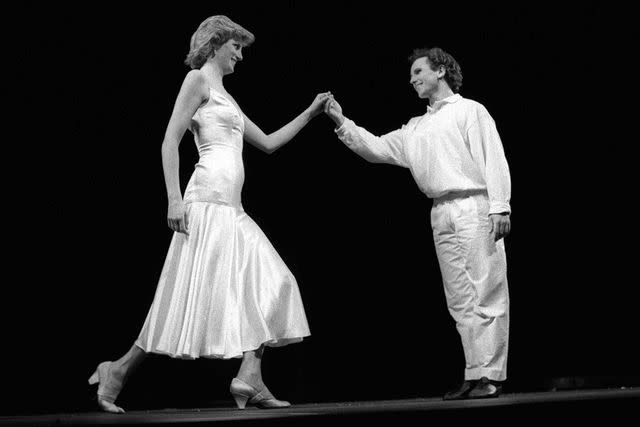 <p>Reg Wilson/Shutterstock </p> Princess Diana dances at the Royal Opera House in 1985