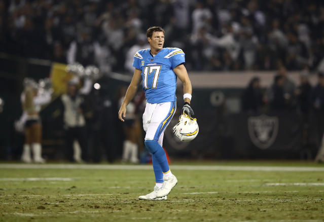 Los Angeles Chargers quarterback Philip Rivers (17) talks with