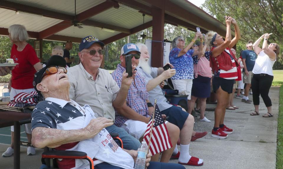 World War II veteran Ed Vrona and his bitrthday party guests watch a flyover of vintage military aircraft at his 104th birthday celebration on July 4th at Emory L. Bennett Memorial Veterans Nursing Home in Daytona Beach. Vrona died on July 14 after battling prostate cancer.