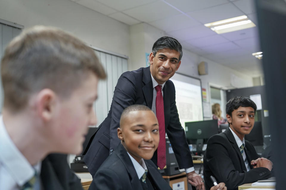 Britain's Prime Minister Rishi Sunak meets Year 9 students taking part in a personal development lesson as he visits Haughton Academy to outline plans for the banning of single use vapes, in Darlington, England, Monday, Jan. 29, 2024. (Ian Forsyth/Pool Photo via AP)