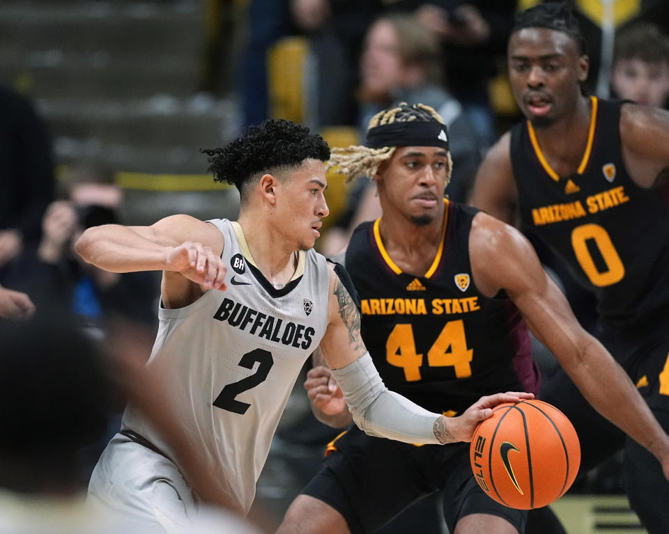 Colorado guard KJ Simpson, front, drives past Arizona State guards Adam Miller, center, and Kamari Lands during the first half of an NCAA college basketball game Thursday, Feb. 8, 2024, in Boulder, Colo. (AP Photo/David Zalubowski)