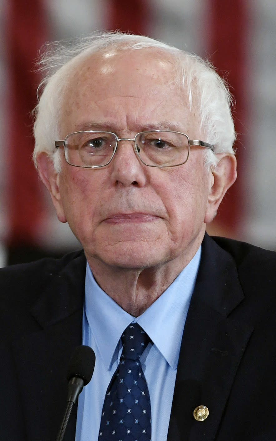 Sanders speaking at a high school in 2019