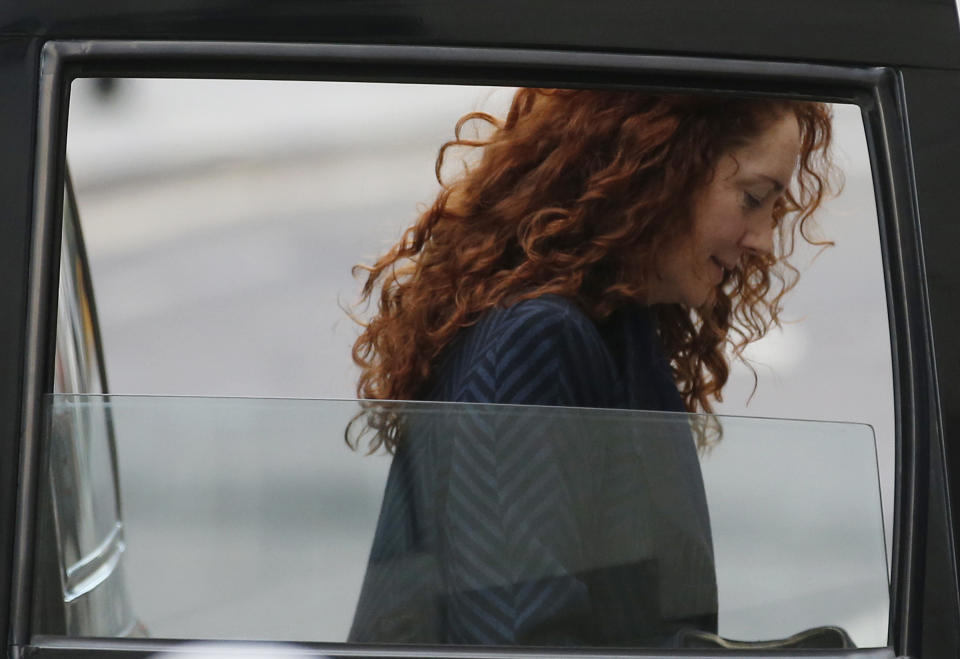 Rebekah Brooks, former News International chief executive, arrives at the Central Criminal Court in London where she appear to face charges related to phone hacking, Wednesday, Feb. 19, 2014. Almost four months into her trial, Brooks is finally getting her day in court. After watching in silence from the dock as her alleged crimes were dissected, the 45-year-old former newspaper editor, once Rupert Murdoch's top British lieutenant, is expected to take the stand to rebut charges of phone hacking, bribery and obstructing a police investigation. (AP Photo/Sang Tan)