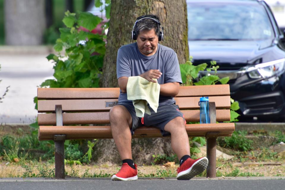 Glenn Jovellanos, of Maywood, wipes the sweat from his body at the Saddle River County Park - Otto C. Pehle Area in Saddle Brook, N.J. on Monday July 20, 2020. 