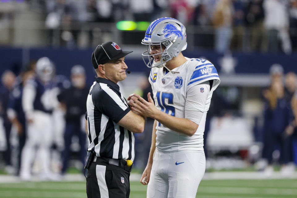 Detroit Lions quarterback Jared Goff (16) talks with umpire Duane Heydt after a 2-point conversion play by the Lions against the Dallas Cowboys in the second half of an NFL football game, Saturday, Dec. 30, 2023, in Arlington, Texas. The Cowboys won 20-19. (AP Photo/Michael Ainsworth)