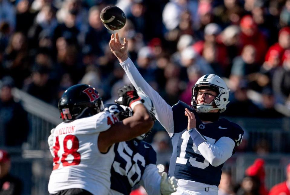 Penn State quarterback Drew Allar makes a pass over Rutgers defenders during the game on Saturday, Nov. 18, 2023.