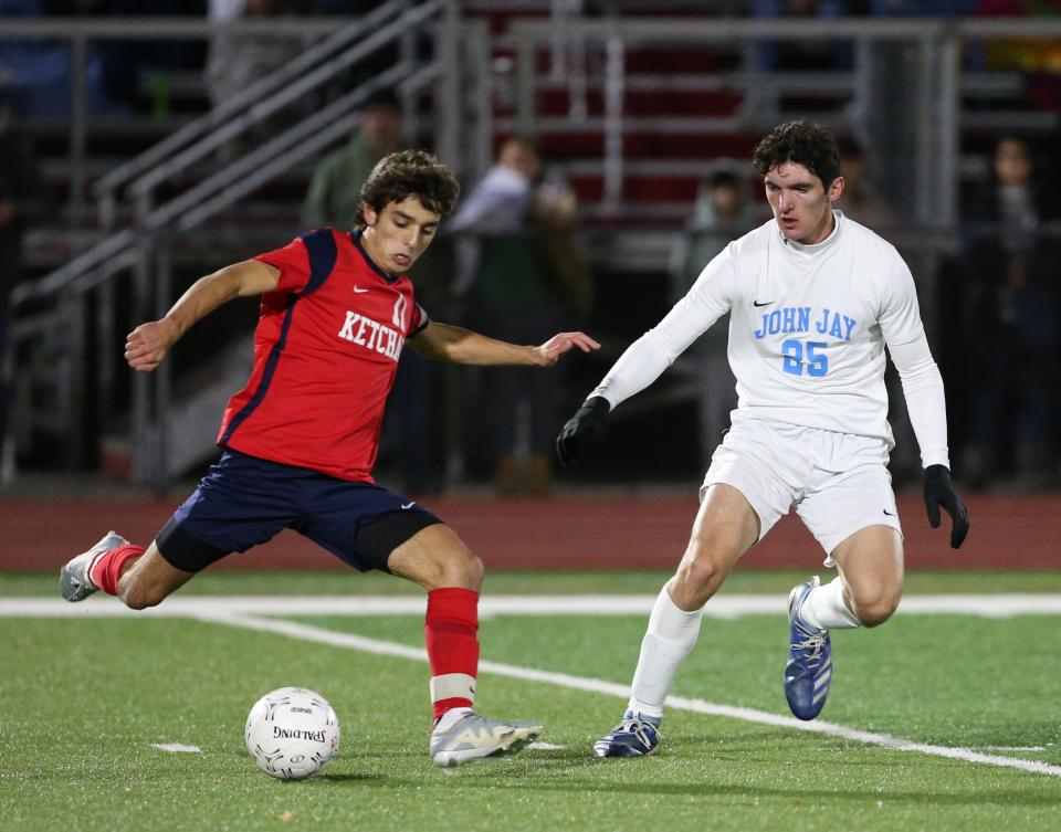 Ketcham's Ryan Zindler (left) about to pass against John Jay in the playoffs.