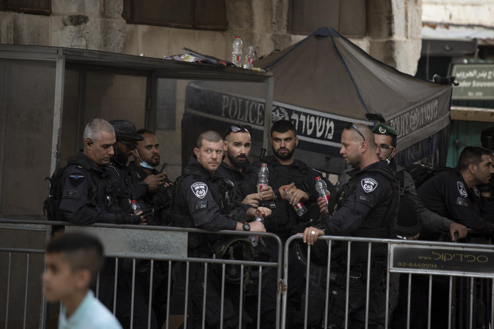 Israeli police stand guard at a checkpoint in the Old City of Jerusalem, Friday, Sept. 10, 2021. Amid increased Israeli-Palestinian tension over a recent prison break, Israeli police said an officer was lightly injured by a firearm in an attempt to thwart a suspected stabbing attack in the area. The Police, which arrested the suspect, did not immediately say how the officer was injured. (AP Photo/Maya Alleruzzo)