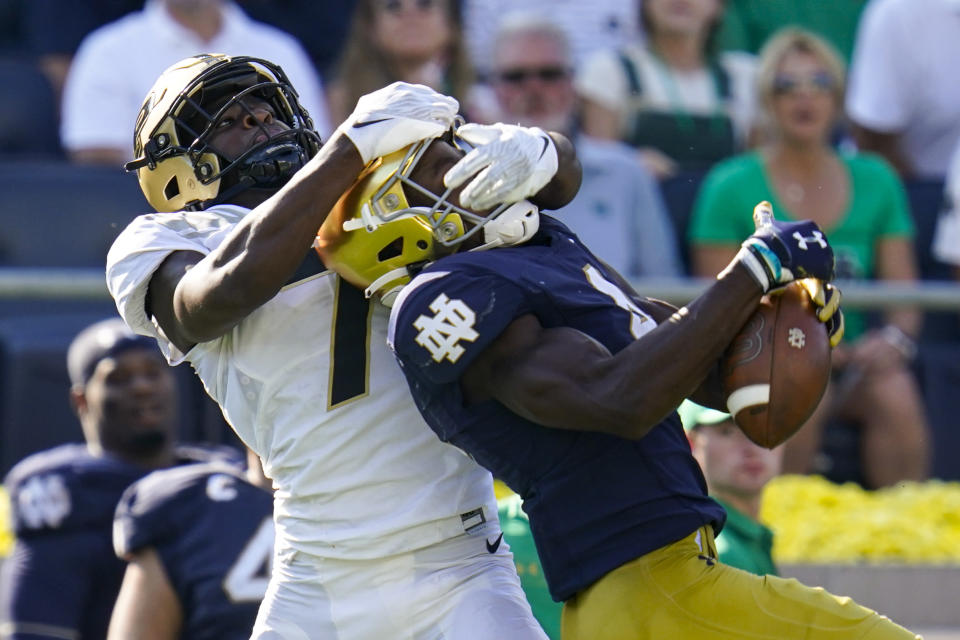 Purdue cornerback Jamari Brown (7) breaks up a pass to Notre Dame wide receiver Kevin Austin Jr. (4) during the second half of an NCAA college football game in South Bend, Ind., Saturday, Sept. 18, 2021. Notre Dame defeated Purdue 27-13. (AP Photo/Michael Conroy)