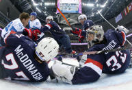 USA goaltender Jonathan Quick and defenseman Ryan McDonagh (27) block a shot by Finland defenseman Kimmo Timonen during the men's bronze medal ice hockey game at the 2014 Winter Olympics, Saturday, Feb. 22, 2014, in Sochi, Russia. (AP Photo/Bruce Bennett, Pool)