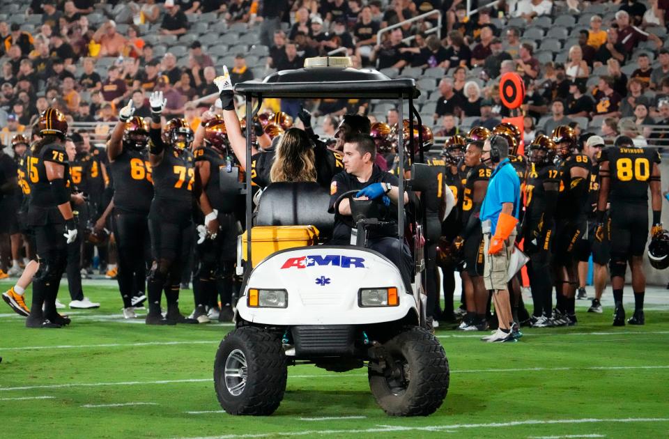 Arizona State Sun Devils offensive lineman Emmit Bohle (70) waves to his teammates after suffering an injury against the Oklahoma State Cowboys in the first half at Mountain America Stadium in Tempe on Sept. 9, 2023.