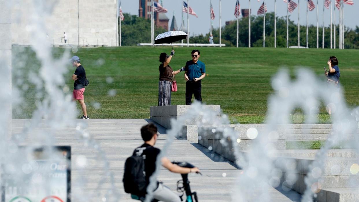 PHOTO: Visitors walk around the fountain of the World War II Memorial, Aug. 28, 2024, in Washington.  (Anna Moneymaker/Getty Images)